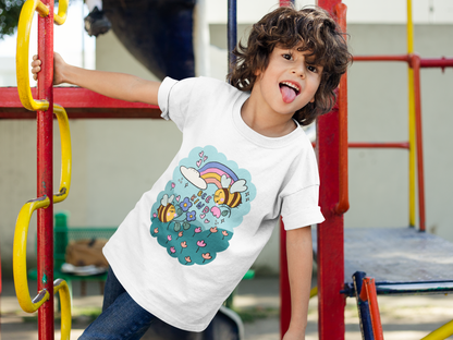 A young boy wearing a t-shirt with a print of two bees in a field of flowers.