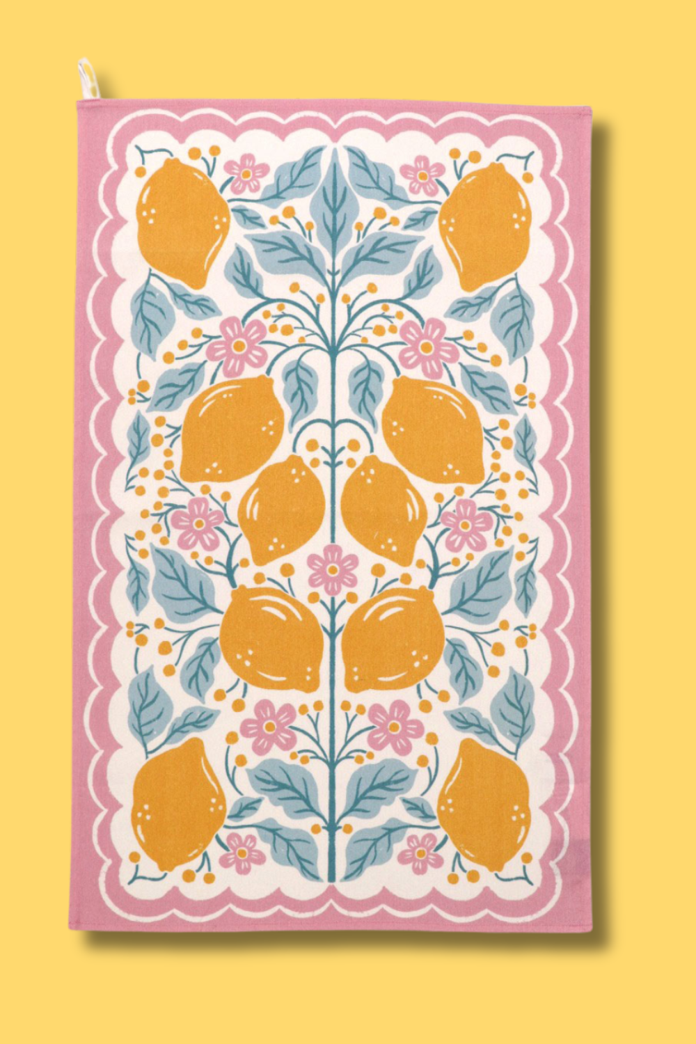 A cotton tea towel with a Folksy Lemon Print against a yellow background