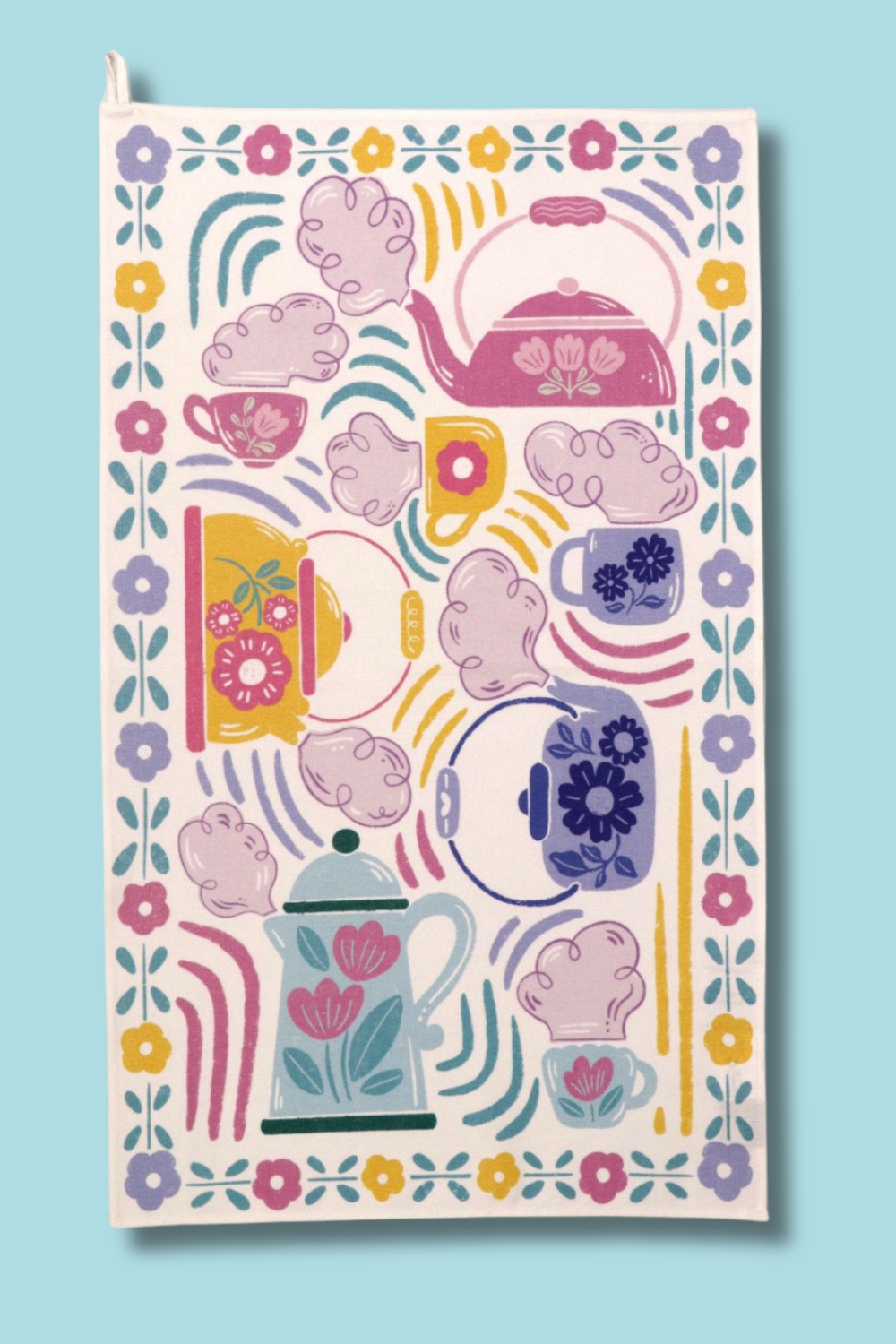 A white cotton tea towel with a print of teapots and teacups against a sky blue background